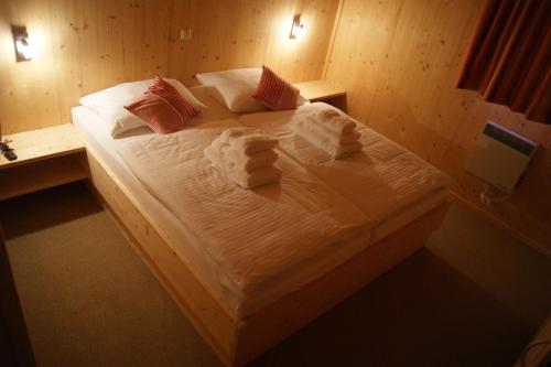 A bed or beds in a room at The Lodge
