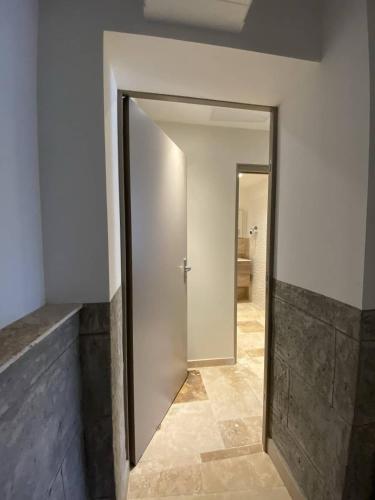 a hallway with a door in a room at L'Arche de Porquerolles in Porquerolles