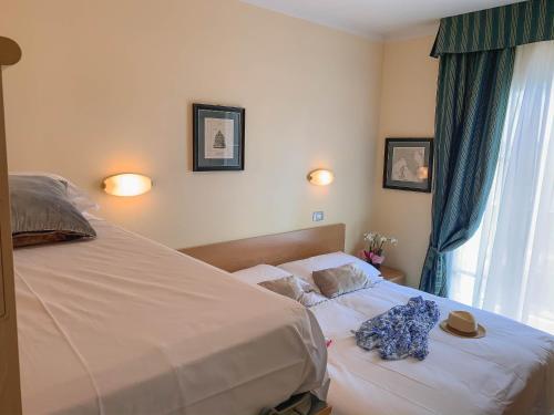 Postel nebo postele na pokoji v ubytování Hotel La Bitta