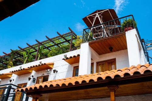 a building with a windmill on top of it at Le Foyer Arequipa in Arequipa