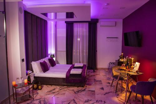 TV a/nebo společenská místnost v ubytování Hotel Ibisco Suites & Relax