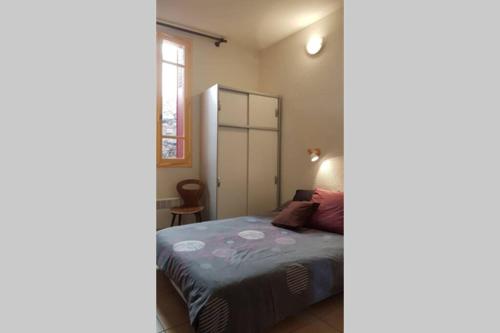 Postel nebo postele na pokoji v ubytování Joli Appartement, terrasse plein sud