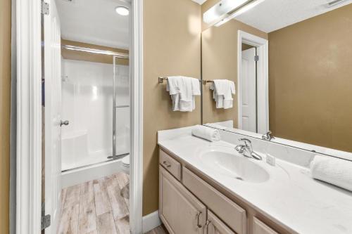 a bathroom with a sink and a shower at Phoenix X Unit 1211 in Orange Beach