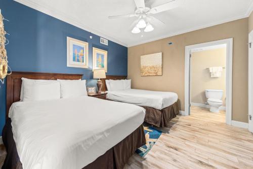 a hotel room with two beds and a toilet at Phoenix X Unit 1211 in Orange Beach