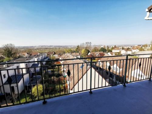 a balcony with a view of a city at Le 79 Reflet de la Marne in Noisy-le-Grand