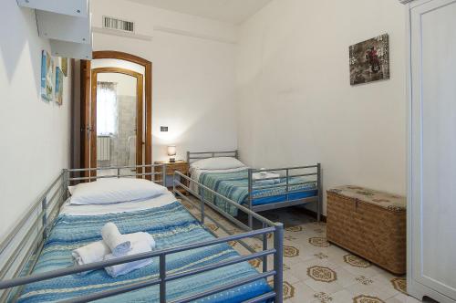 Säng eller sängar i ett rum på La Limonaia