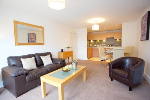 a living room with a couch and a table at Citystay Living - The Vie in Cambridge