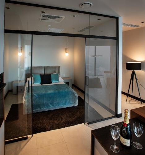 Кровать или кровати в номере In The Sky - Apartamenty w Sky Tower