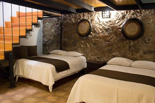 Postel nebo postele na pokoji v ubytování Hotel Suites Sofia