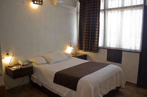 Cama o camas de una habitación en Hotel Suites Sofia