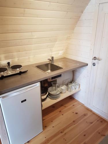 a kitchen with a sink and a counter top at Camping du Staedly in Roeschwoog