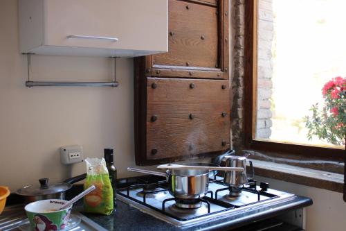 Kuchyň nebo kuchyňský kout v ubytování Hotel San Rufino