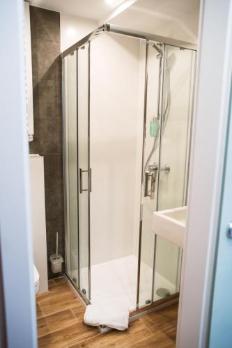 a bathroom with a shower and a sink at Gold Hotel in Złotoryja