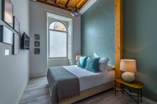 Ένα ή περισσότερα κρεβάτια σε δωμάτιο στο Bacharéis Charming House