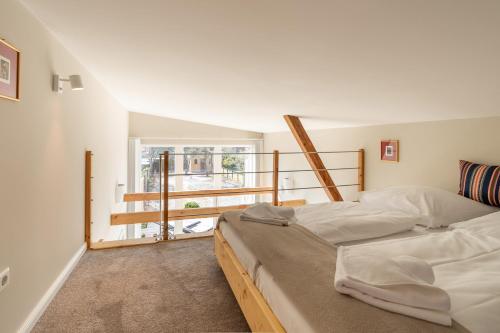 Llit o llits en una habitació de Stadthaus Brüggemann