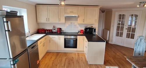 A kitchen or kitchenette at Sherwood Bungalow 3 Bedroom Entire Property