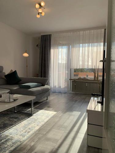 a living room with a couch and a table at Mariposa 2 in Bad Harzburg