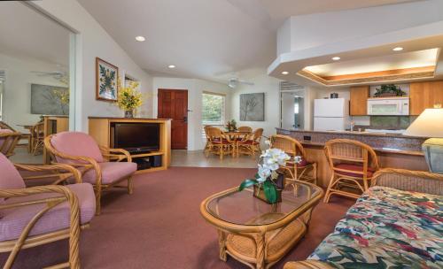 a living room with a couch and chairs and a table at Club Wyndham Bali Hai Villas in Princeville