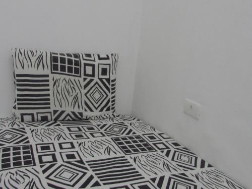 Кровать или кровати в номере Hostel com quartos individuais