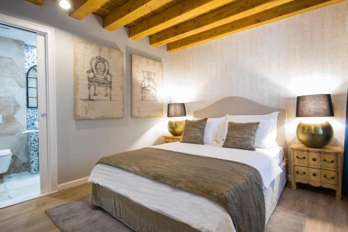 En eller flere senge i et værelse på Palacio Celeste