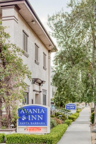 a sign for a mansion in front of a building at Avania Inn of Santa Barbara in Santa Barbara
