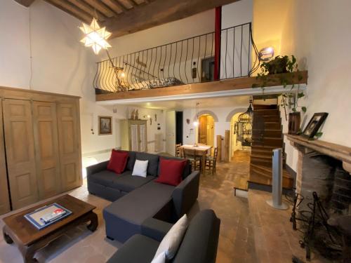 a living room with a couch and a table at Gioielli Di Priori in Perugia