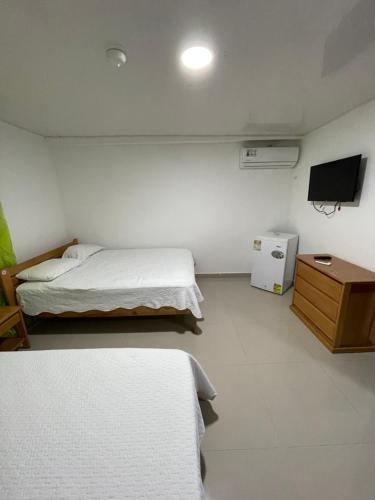 Cama o camas de una habitación en Posada Yasa sarie bay