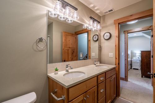 a bathroom with a sink and a mirror at Northern Lights #71 in Chelan