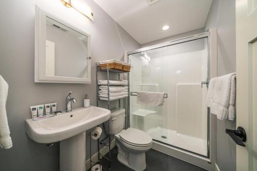 a bathroom with a sink and a toilet and a shower at Lake Escape #99 in Chelan