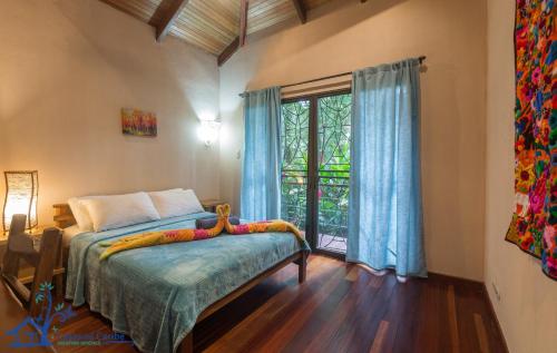 A bed or beds in a room at Casa Koda Beach Front