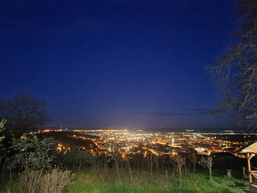 a view of a city lit up at night at Bella Vista Turda in Turda