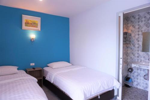 Ένα ή περισσότερα κρεβάτια σε δωμάτιο στο Dozy Lamoon House