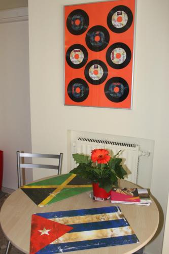 a table with a bunch of records on the wall at B&B Dietro l'Angolo in Benevento
