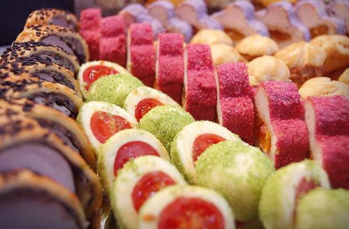 a bunch of pastries sitting on a table at COMPLEX PANORAMIC in Slănic-Moldova