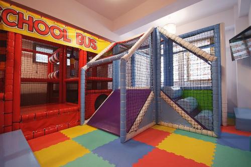 a play room with a play set with a slide at COMPLEX PANORAMIC in Slănic-Moldova