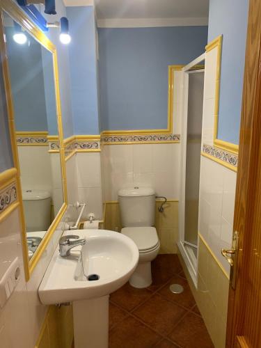 a bathroom with a white toilet and a sink at Casa KIKO, LA CASA ESTA EN LA ANTILLA 200METROS PLAYA in La Antilla