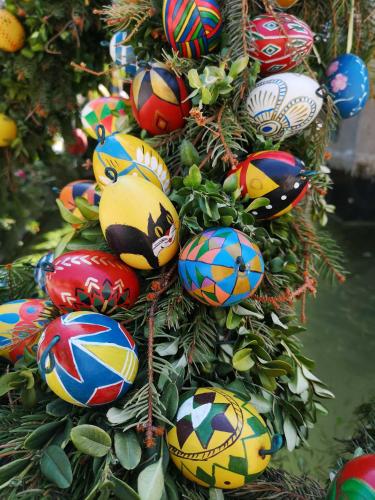a christmas tree with colorful christmas ornaments on it at Appartment Schlossblick in Wiesenthau