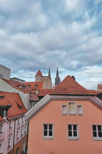a view of a city with buildings and roofs at Hotel Roter Hahn in Regensburg