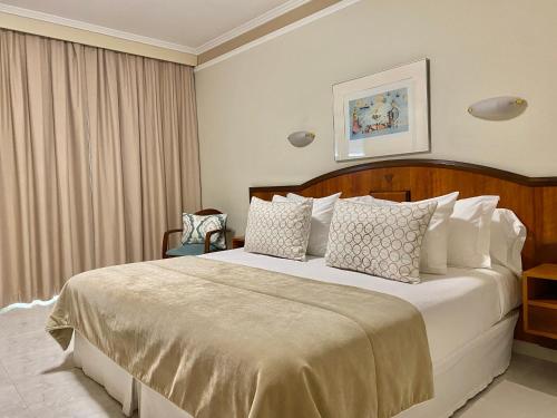 A bed or beds in a room at Nuevo Astur Spa