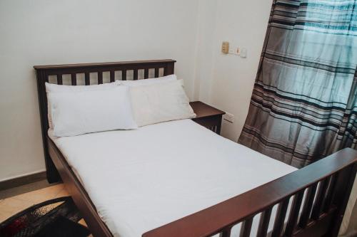 Ένα ή περισσότερα κρεβάτια σε δωμάτιο στο Stunning 2-Bed Apartment in Dar es Salaam