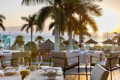 
A restaurant or other place to eat at Red Level at Gran Melia Palacio de Isora - Adults Only
