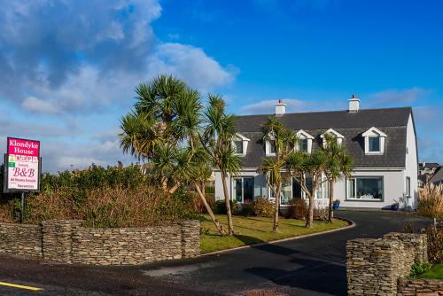 a house with a sale sign in front of it at Klondyke House B&B in Waterville