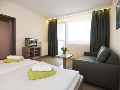 Телевизор и/или развлекательный центр в Kurhotel zu Heringsdorf