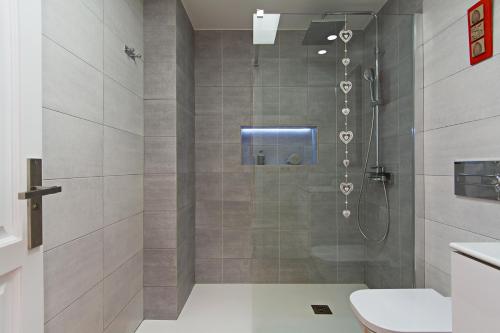 a bathroom with a shower with a toilet at Apartment Fragata in Playa Honda