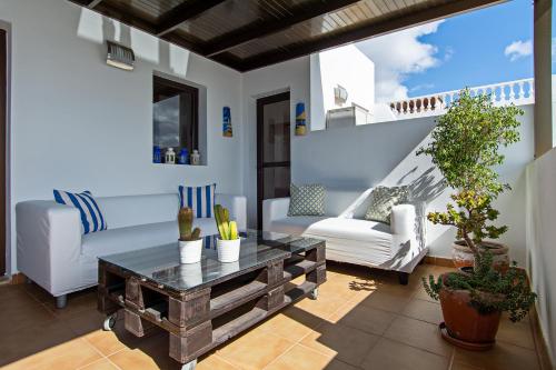 a living room with a couch and a coffee table at Apartment Fragata in Playa Honda