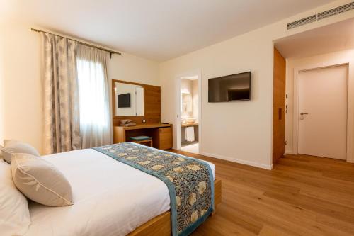 Кровать или кровати в номере Relais Althea Azienda Agrituristica