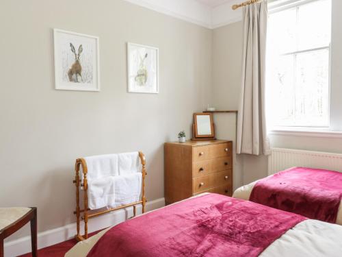 Llit o llits en una habitació de Kirklands Garden House