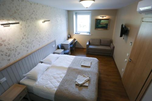 Una cama o camas en una habitación de Hotel Jonapolis
