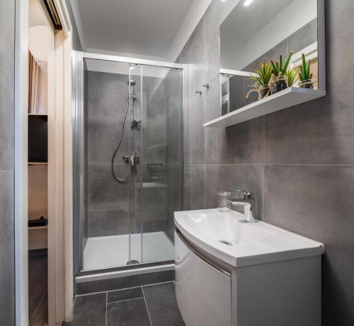 a bathroom with a shower and a sink at Luxury Studios & Room Five in Split