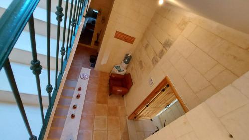 an overhead view of a staircase in a building at Just a Simple Room at Happy and Healthy Gozo in Victoria